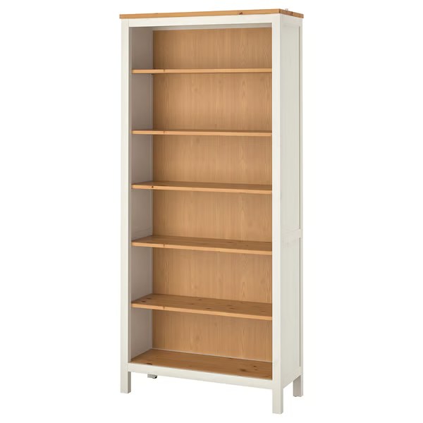 A tall, narrow bookshelf with a white frame and wooden shelves, designed for storage and display.